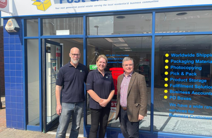 Sir Robert Buckland Photographed with Shani and Darren at the new Post and Packaging Store in Swindon Town Centre