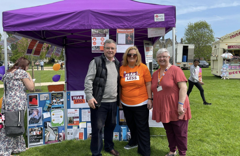 Sir Robert Buckland with volunteers from the charity, FearLess, at the Swindon Mela