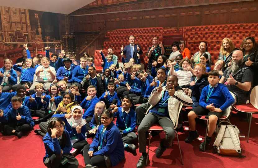 Sir Robert Buckland MP photographed with children and staff from Hazelwood Academy on their recent visit to Parliament