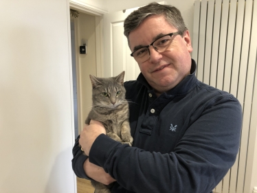 Robert Buckland MP pictured with his new cat, Mrs Landingham