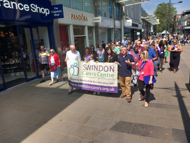 Sir Robert Buckland KBE KC MP Taking part in the Swindon Carers Walk a Mile Event as part of Carers Week 2023