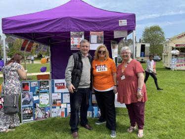 Sir Robert Buckland with volunteers from the charity, FearLess, at the Swindon Mela